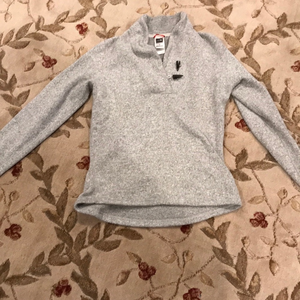 North Face size small pullover jacket.